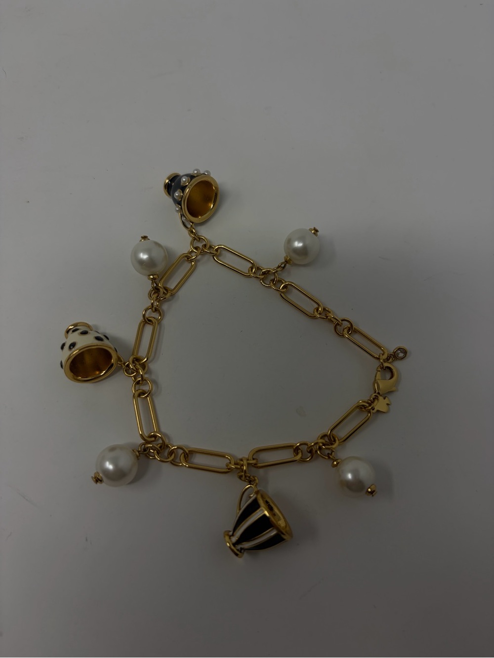 Kate Spade Gold Tea Cup Bracelet from the Alice in Wonderland Collection